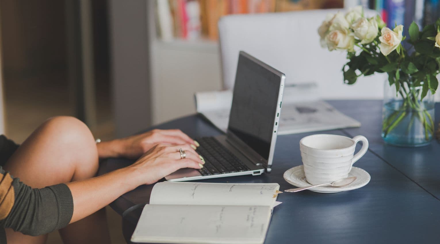 woman sitting at home computer desk